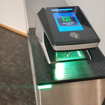 Fastlane turnstile with integrated biometric reader providing touchless access for a smoother user experience