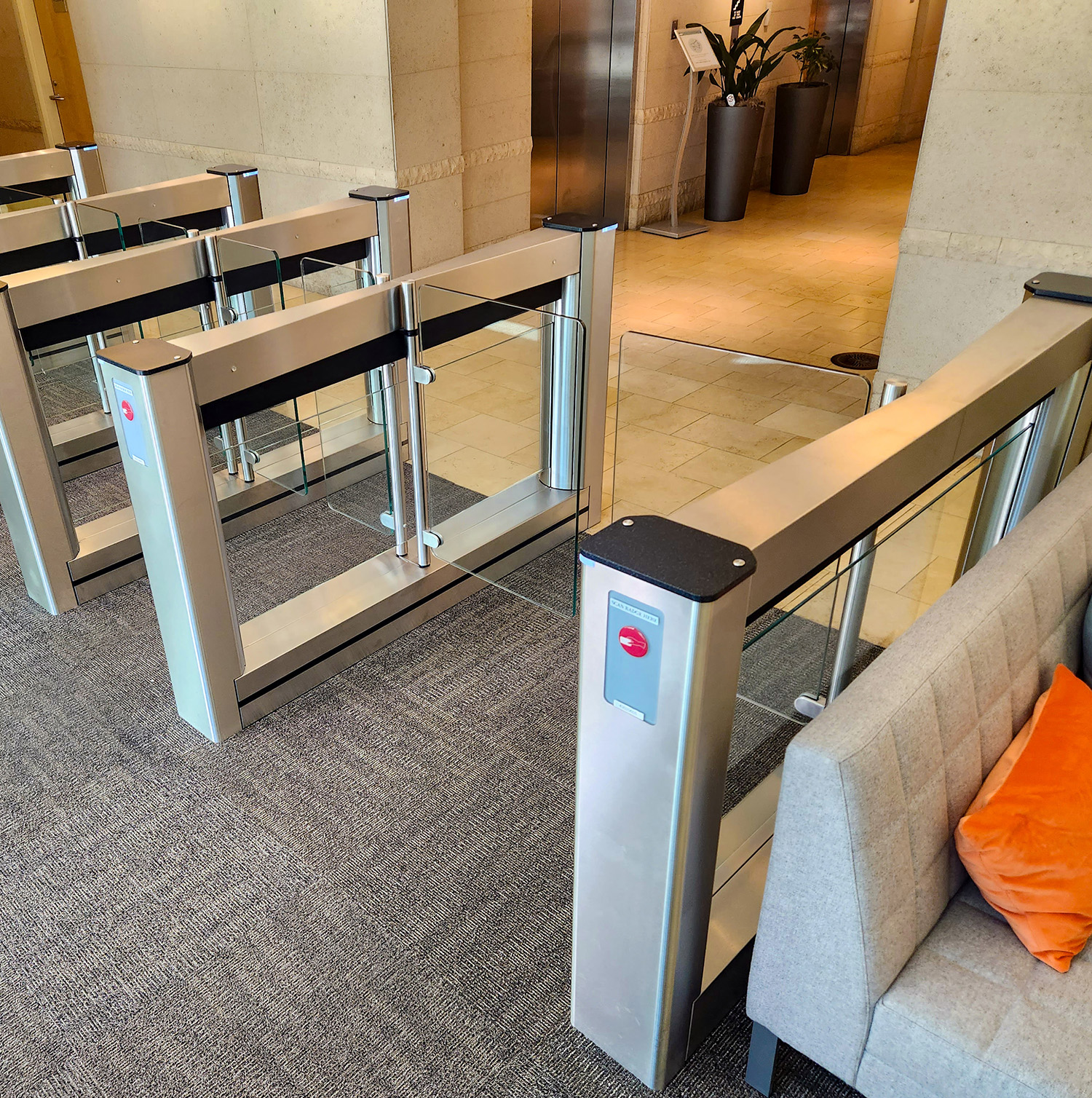 Energy-efficient Fastlane turnstiles operating at 60 watts per lane in a sustainable building lobby